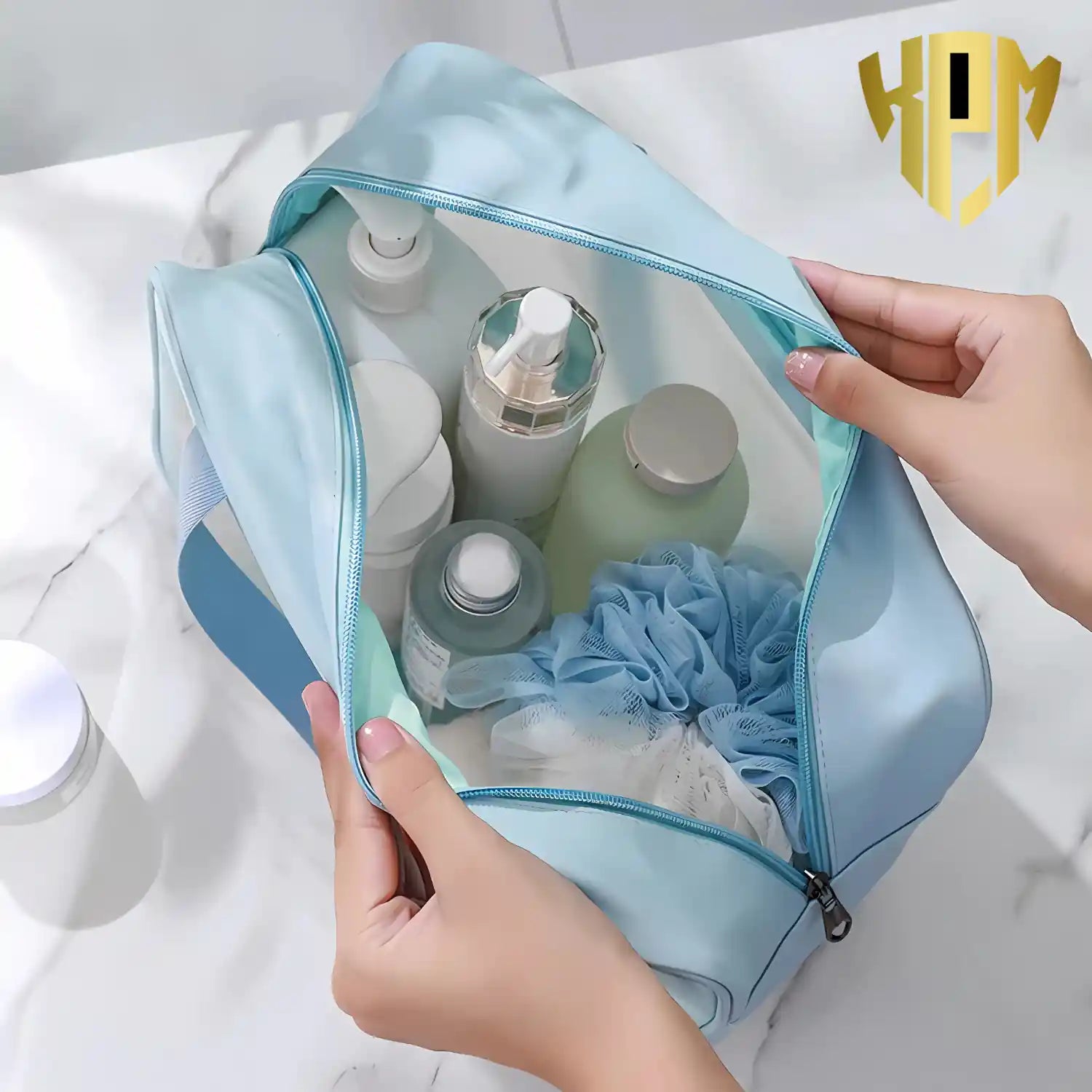 KPM WORLD™ large-capacity blue travel wash bag with spacious interior for storing shampoo bottles, skincare products, toiletries, and bath accessories.