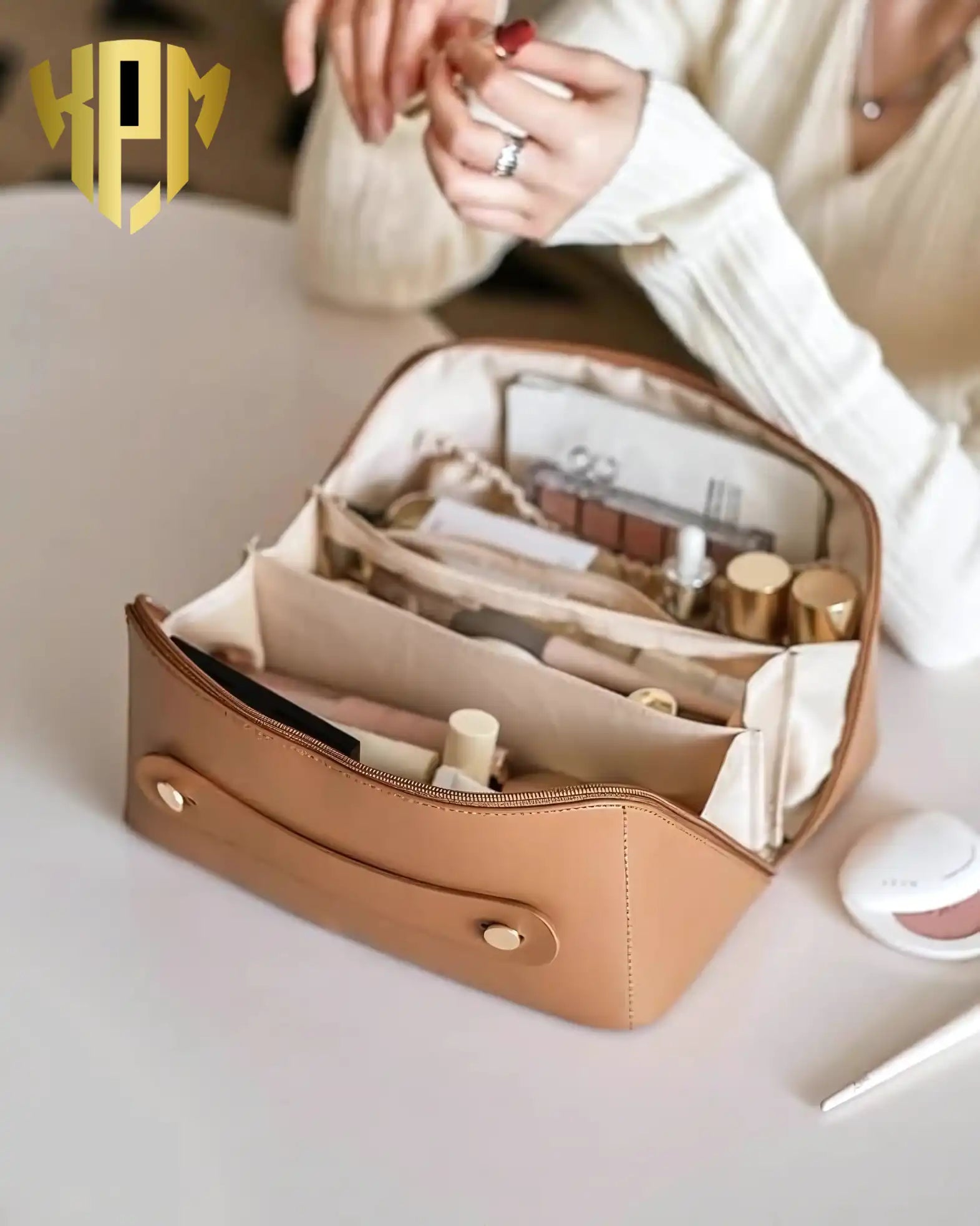 KPM WORLD™ brown leather cosmetic organizer with spacious compartments neatly storing makeup, skincare products, brushes, and beauty essentials for everyday organization.