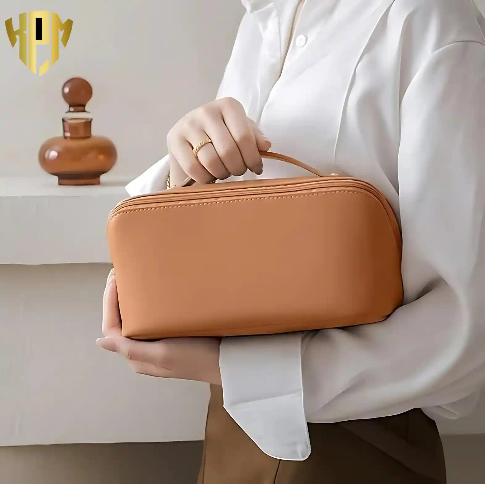 KPM WORLD™ premium brown leather cosmetic bag with ergonomic top handle, elegant minimalist design, and portable travel-ready construction for everyday use.