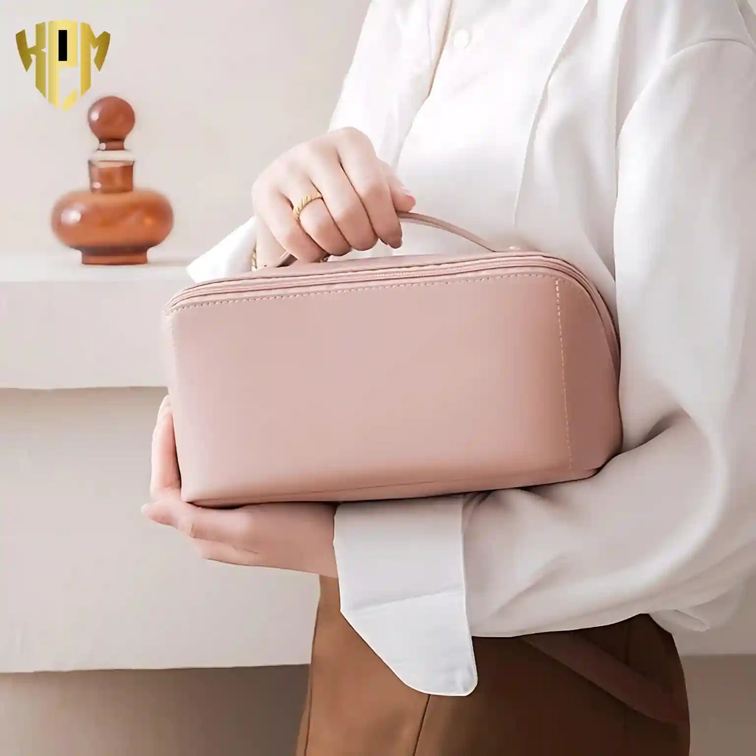 KPM WORLD™ elegant pink PU leather makeup organizer featuring a comfortable top handle, premium finish, and portable design for travel and everyday use.shop_this_look_amDhCa