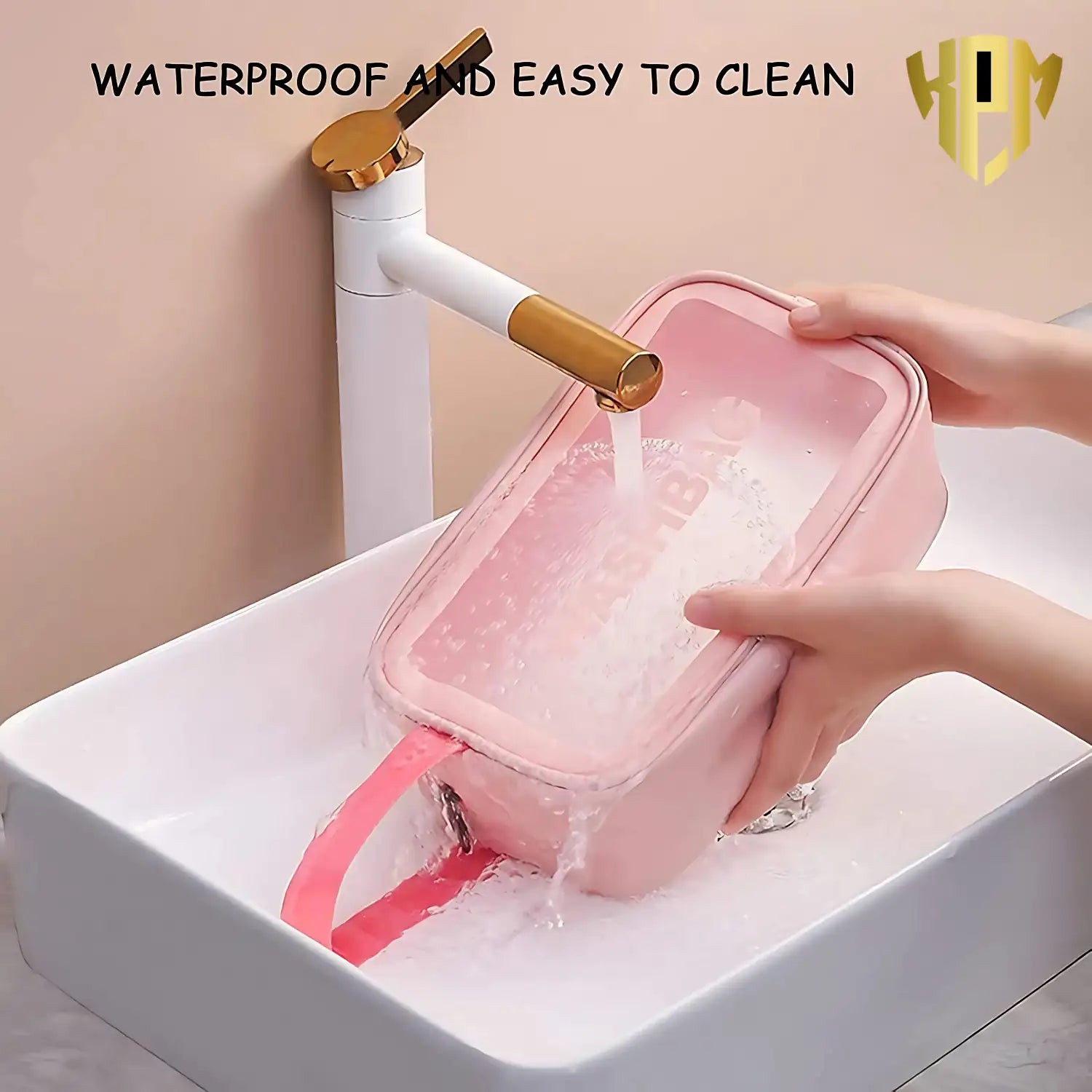 KPM WORLD™ pink waterproof cosmetic wash bag being rinsed under running water, demonstrating its easy-to-clean and water-resistant design.