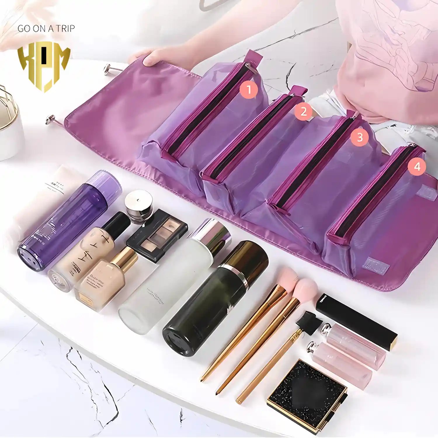 KPM WORLD™ purple 4-in-1 detachable travel organizer showing four removable transparent storage pouches packed with skincare, makeup, and travel essentials.