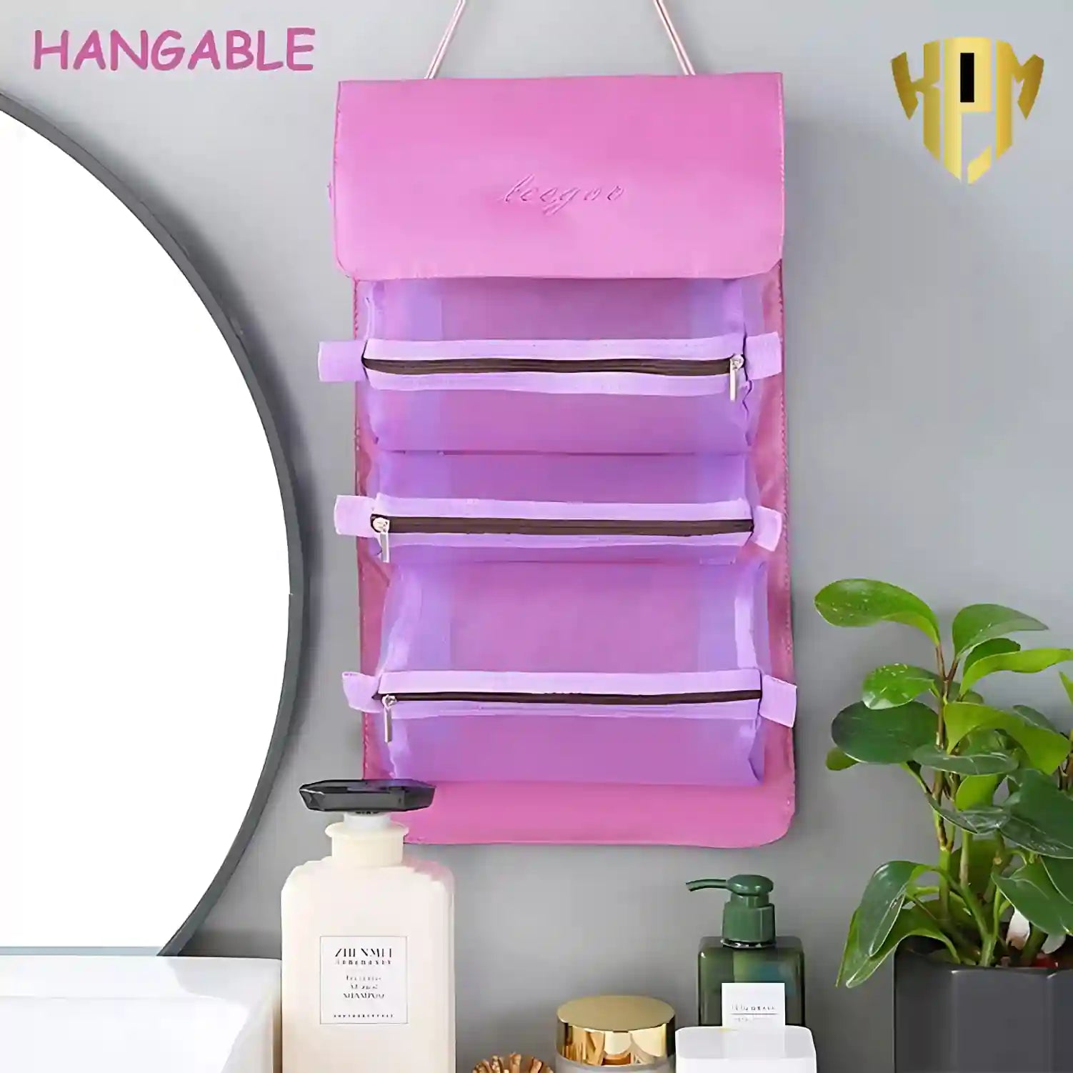 KPM WORLD™ purple hanging toiletry organizer mounted in a bathroom, providing easy-access storage for cosmetics and personal care essentials.